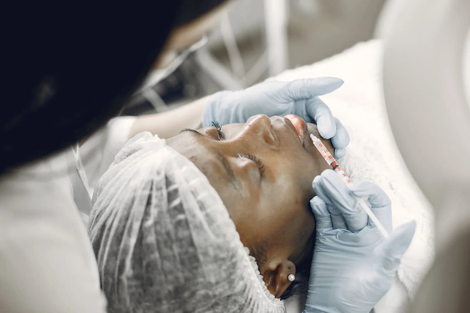 Close-up of a lip filler injection during dermal fillers treatment at a Malta aesthetic clinic