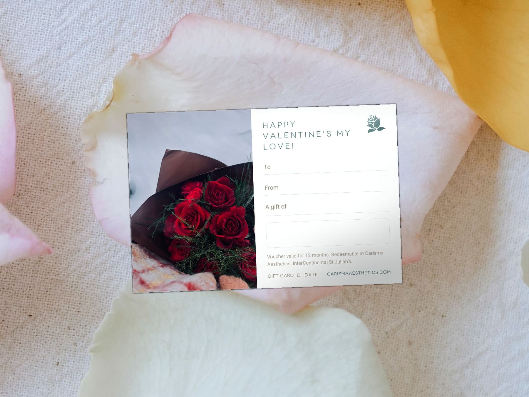 A Carisma Aesthetics Valentine's gift card on bone linen with a gilded fan